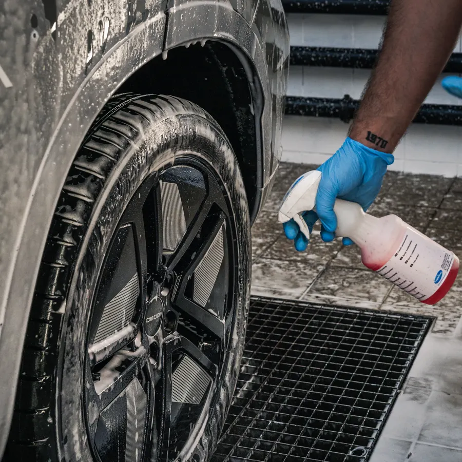 Wheel and tyre being cleaned with a spray-on cleaner