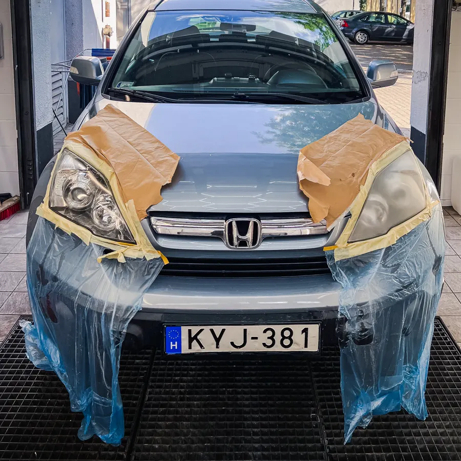 Headlight polishing prepared with masking tape